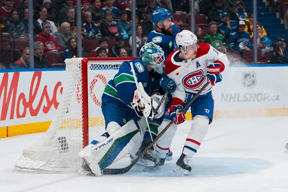 Mar 11, 2025; Vancouver, British Columbia, CAN; Vancouver Canucks goalie Kevin Lankinen (32) and defenseman Filip Hronek (17) battle with Montreal Canadiens forward Brendan Gallagher (11) in the third period at Rogers Arena. Mandatory Credit: Bob Frid-Imagn Images