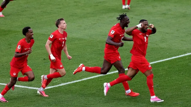 Cyle Larin (No. 9) celebrates his second half goal against Bosnia-Herzegovina.